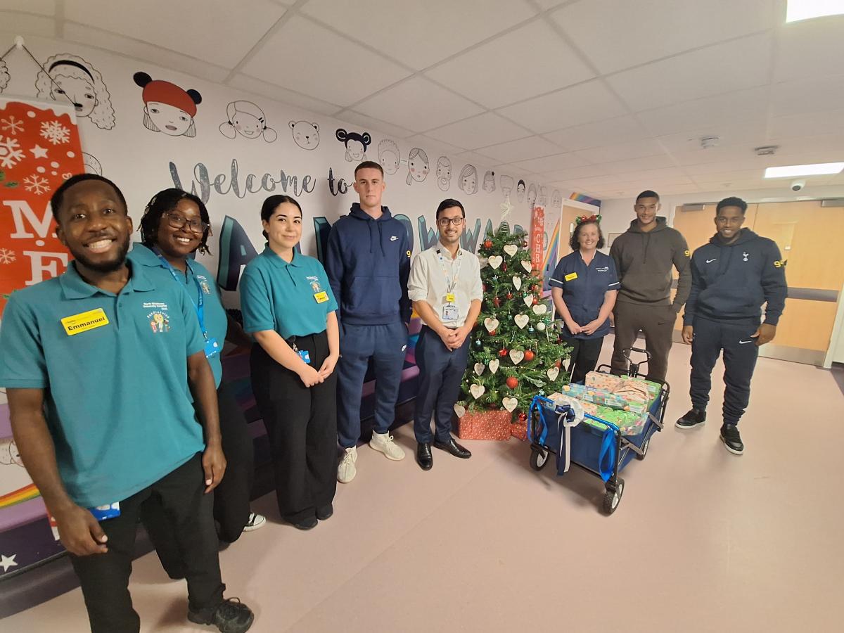 The Play Team, John Sparrowhawk and Clare Oliver with the Spurs players